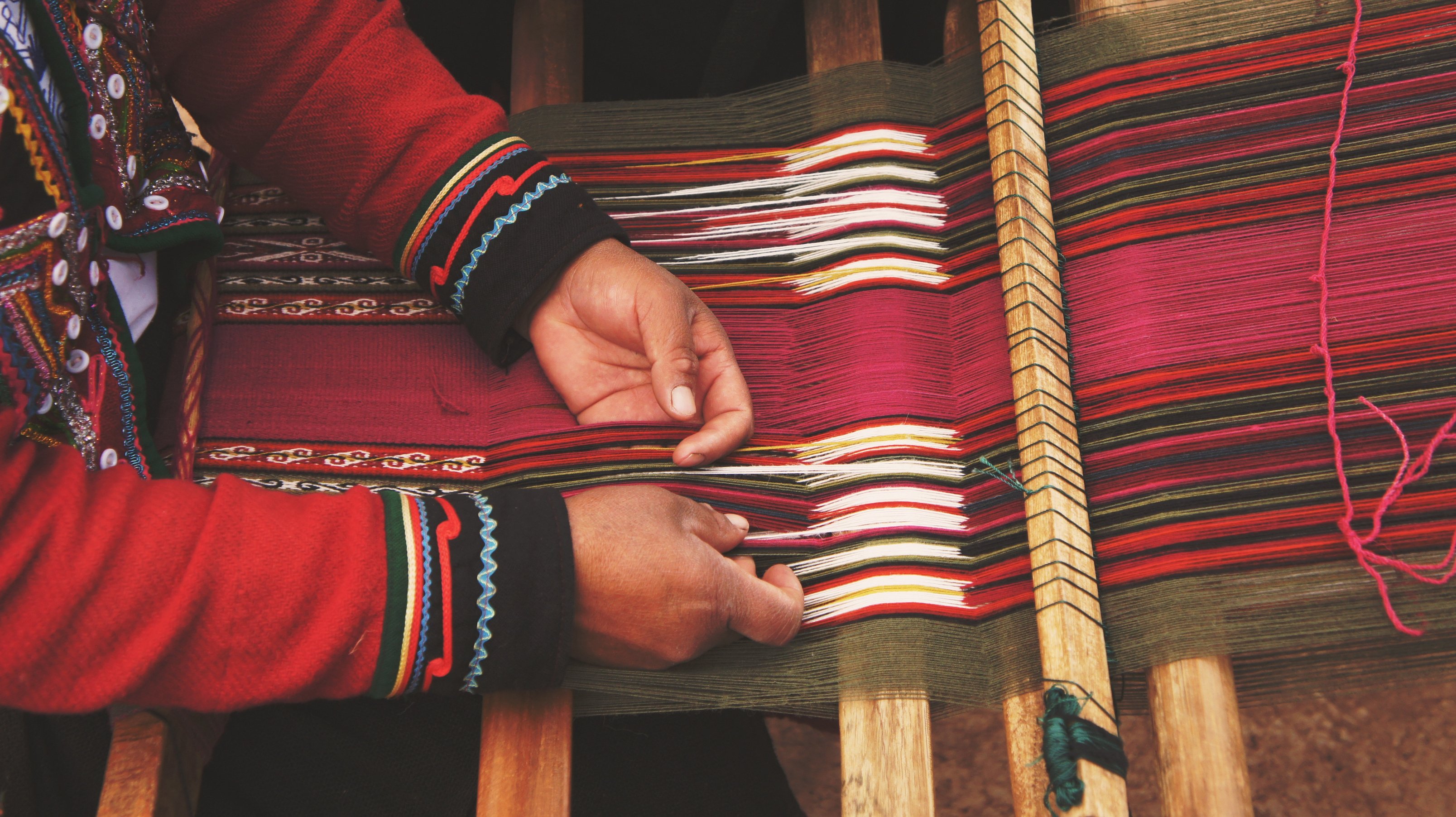 Person Weaving Threads